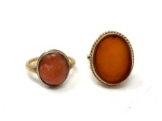 A 9ct gold carnelian ring, together with a further 9ct gold ring set with coral.