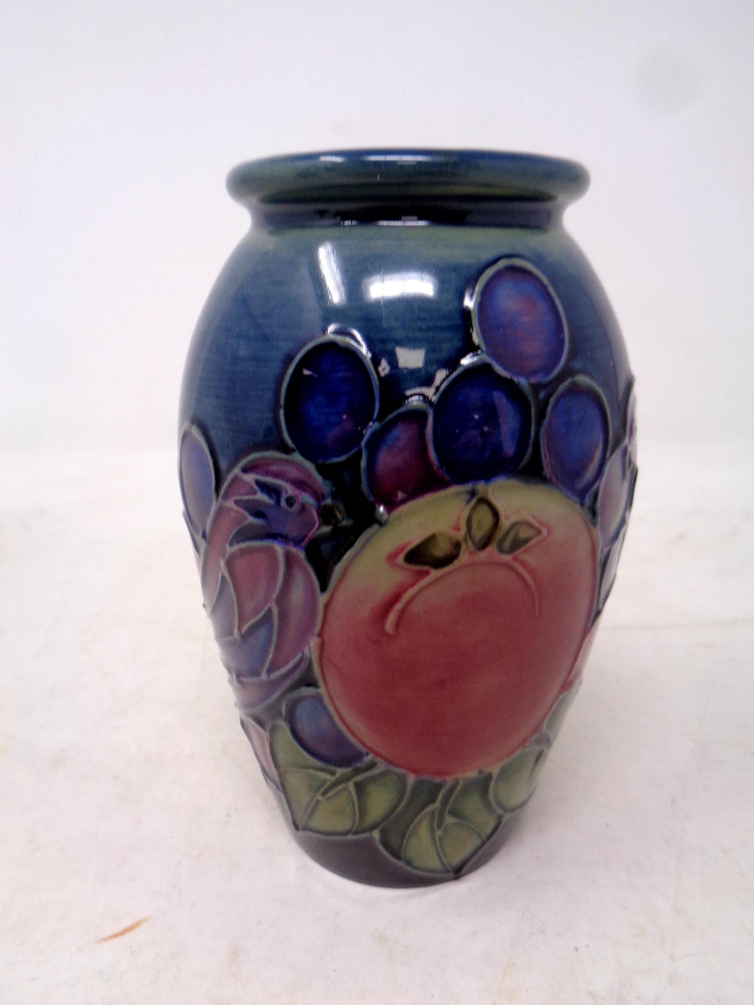 A Moorcroft Pomegranate patterned vase, height 10.
