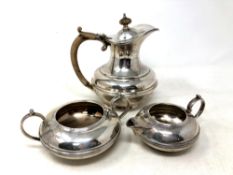 A silver three piece tea service (non matching), comprising of silver teapot, 481.