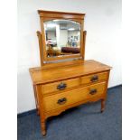 An Edwardian satin wood three drawer dressing chest