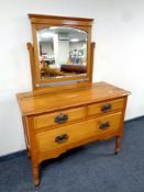 An Edwardian satin wood three drawer dressing chest