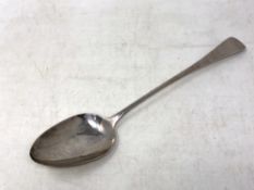 A silver basting spoon, London 1805, 92g, length 31 cm.