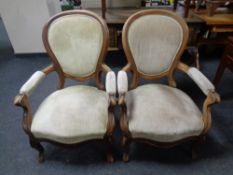 A pair of 19th century mahogany armchairs upholstered in a gold dralon