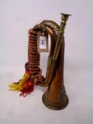 An early 20th century copper and brass bugle
