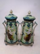 A pair of Noritake lidded vases decorated with swans in flight, height 30.