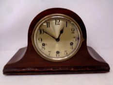 An early 20th century mahogany cased mantel clock with silvered dial