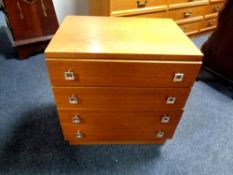 A twentieth century teak four drawer chest