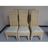 A set of six contemporary wicker high backed dining chairs