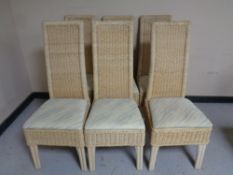 A set of six contemporary wicker high backed dining chairs