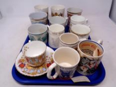 A tray containing a quantity of antique and later commemorative mugs,