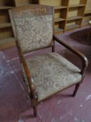 An early 20th century inlaid mahogany armchair upholstered in a floral fabric