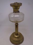 An antique Duplex brass oil lamp with glass reservoir