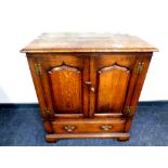 A Titchmarsh and Goodwin Georgian style cabinet fitted a drawer