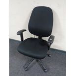 A black fabric upholstered adjustable office armchair