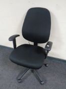 A black fabric upholstered adjustable office armchair