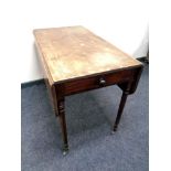 A Victorian mahogany flap sided table fitted a drawer