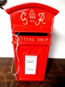 A cast iron George VI style postbox with key