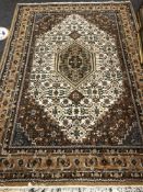 A Persian design carpet, on cream ground,
