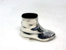 A large heavy silver pin cushion in the shape of a boot, John Grinsell & Sons,