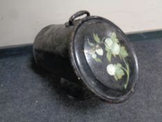 An antique painted tin coal receiver