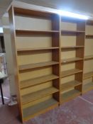 A pair of oak effect open bookshelves