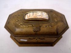 A 19th century gilt metal octagonal jewellery casket with relief panel inset