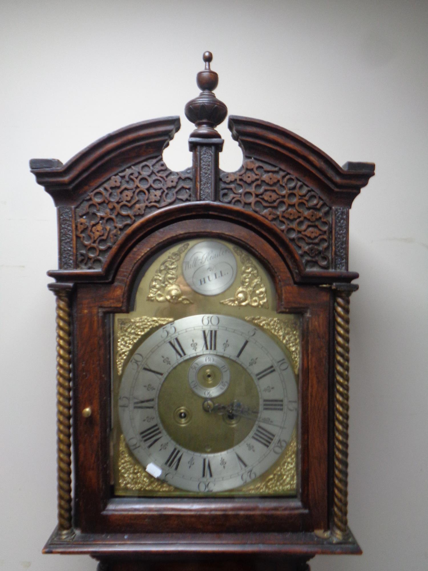 A 19th century carved oak cased longcase clock with brass and enamel dial signed William Reader of - Image 2 of 2