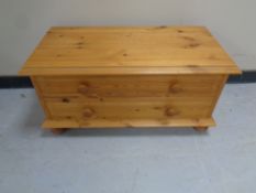 A pine two drawer low chest