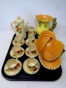 A tray containing a 14 piece Royal Doulton Gem coffee service together with a Burleigh ware jug and
