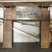 A late 19th century oak fire surround with central panel printed with colour print depicting