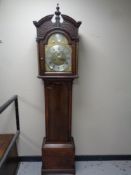 A 19th century carved oak cased longcase clock with brass and enamel dial signed William Reader of