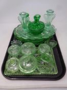 A tray containing 1930s green glass trinket trays,