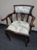 An early 20th century mahogany armchair on cabriole legs