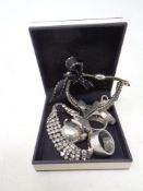 A box containing a collection of silver rings, costume jewellery,