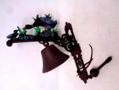 A cast iron duck wall bracket with bell