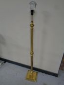 A heavy brass standard lamp on square base (continental wiring)