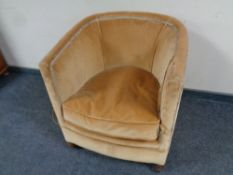 An Art Deco tub chair upholstered in a gold dralon