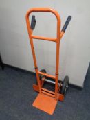 A twin handled adjustable sack barrow with spring axle