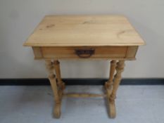An early 20th century pine single drawer work table