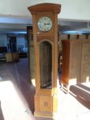 A carved oak cased regulator clock with circular silvered dial