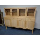 A Rimme Design pine four door sideboard fitted four drawers above,