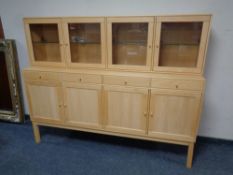 A Rimme Design pine four door sideboard fitted four drawers above,