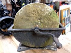 An antique grinding wheel