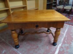 A 1930s oak dining table