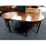 A 19th century mahogany D-end dining table with leaf