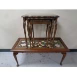 A mahogany coffee table on Queen Anne legs with a tapestry inset panel together with a nest of