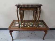 A mahogany coffee table on Queen Anne legs with a tapestry inset panel together with a nest of