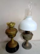 A brass Duplex oil lamp on ceramic base together with a further chrome oil lamp with glass chimney