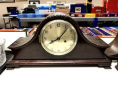 An early 20th century German mahogany cased mantel clock with silvered dial