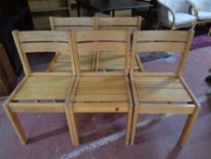 A set of five pine dining chairs